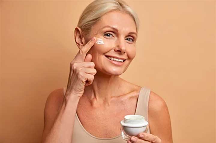 Woman with jar of cream