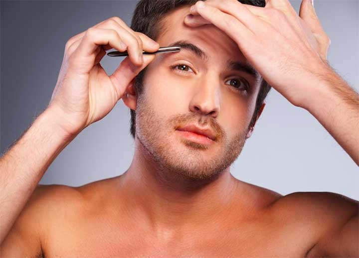 man grooming his eyebrows