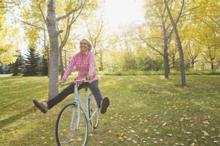 Woman riding a bike in a park