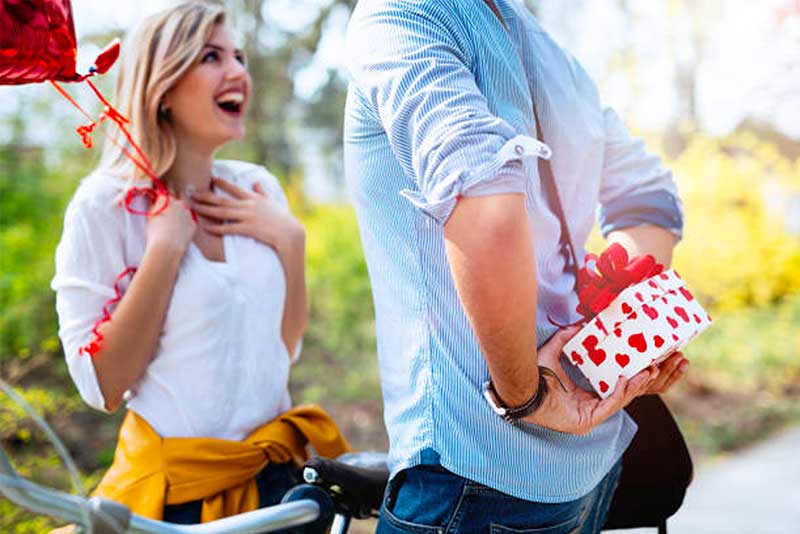 Man giving surprise gift