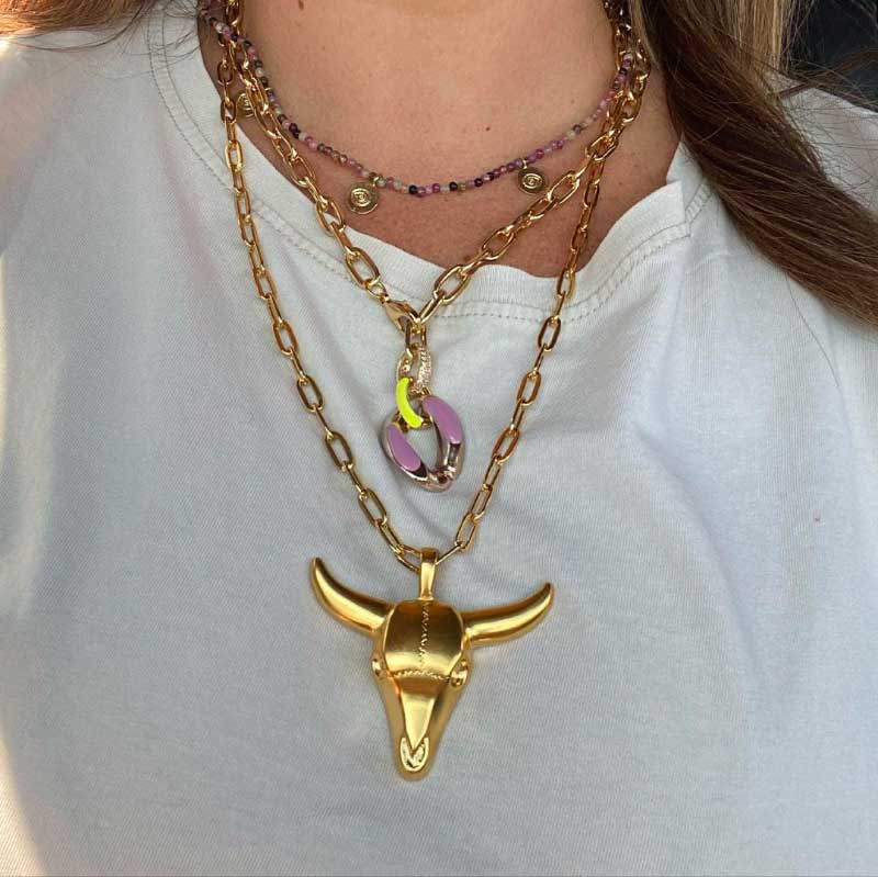Bull necklace meaning: A women wearing bull necklaces