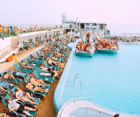 People lying on lounge chairs