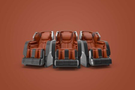 Luxury brown massage chairs against a terracotta background, showcasing comfort and style.