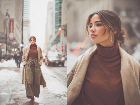 stylish woman strolling through a snow-dusted downtown street